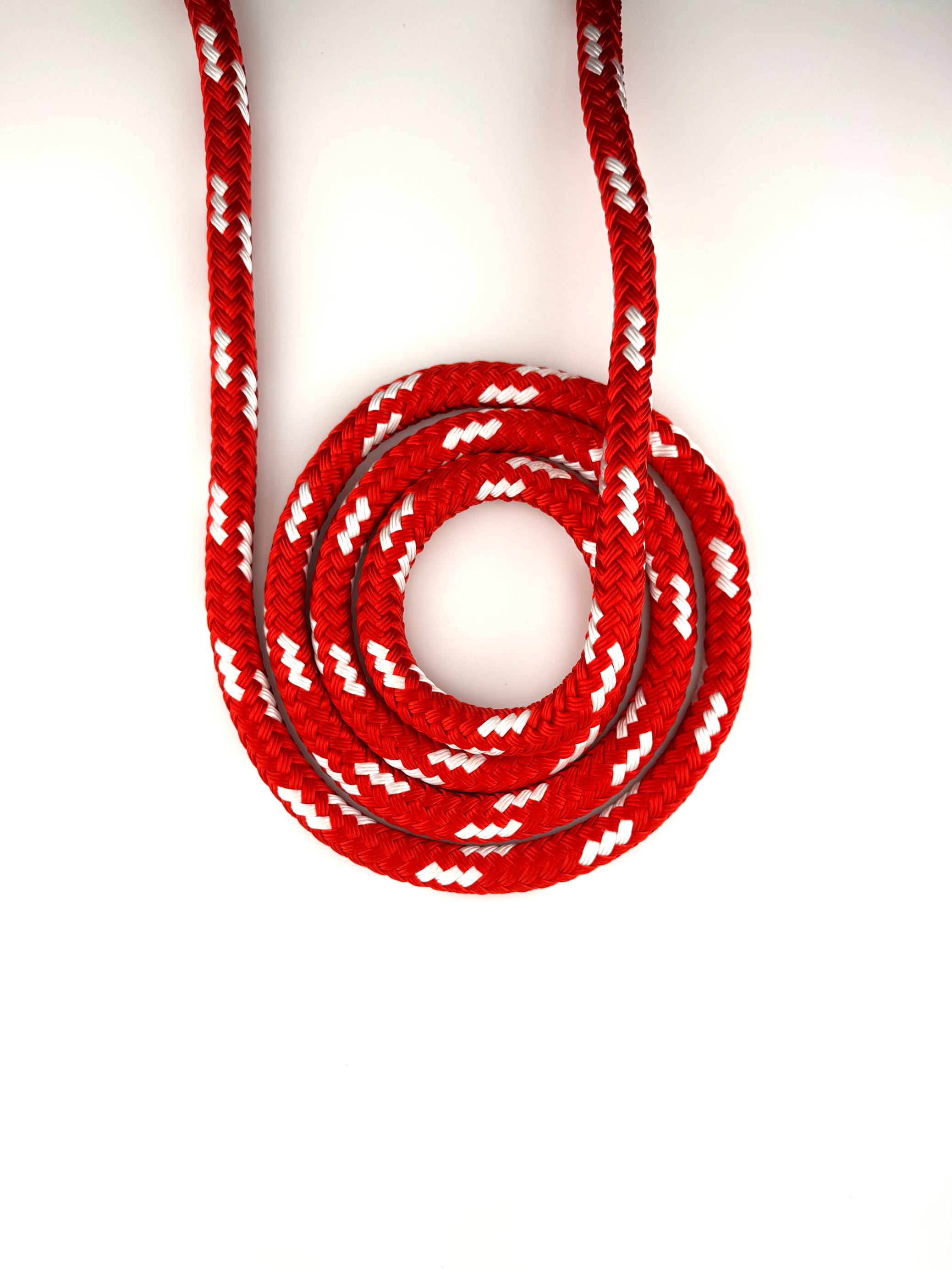 Lupes® Ultra Fancy red double-braided rope with white flecks, made from high-tenacity polyester for low stretch, durability, and smooth handling.